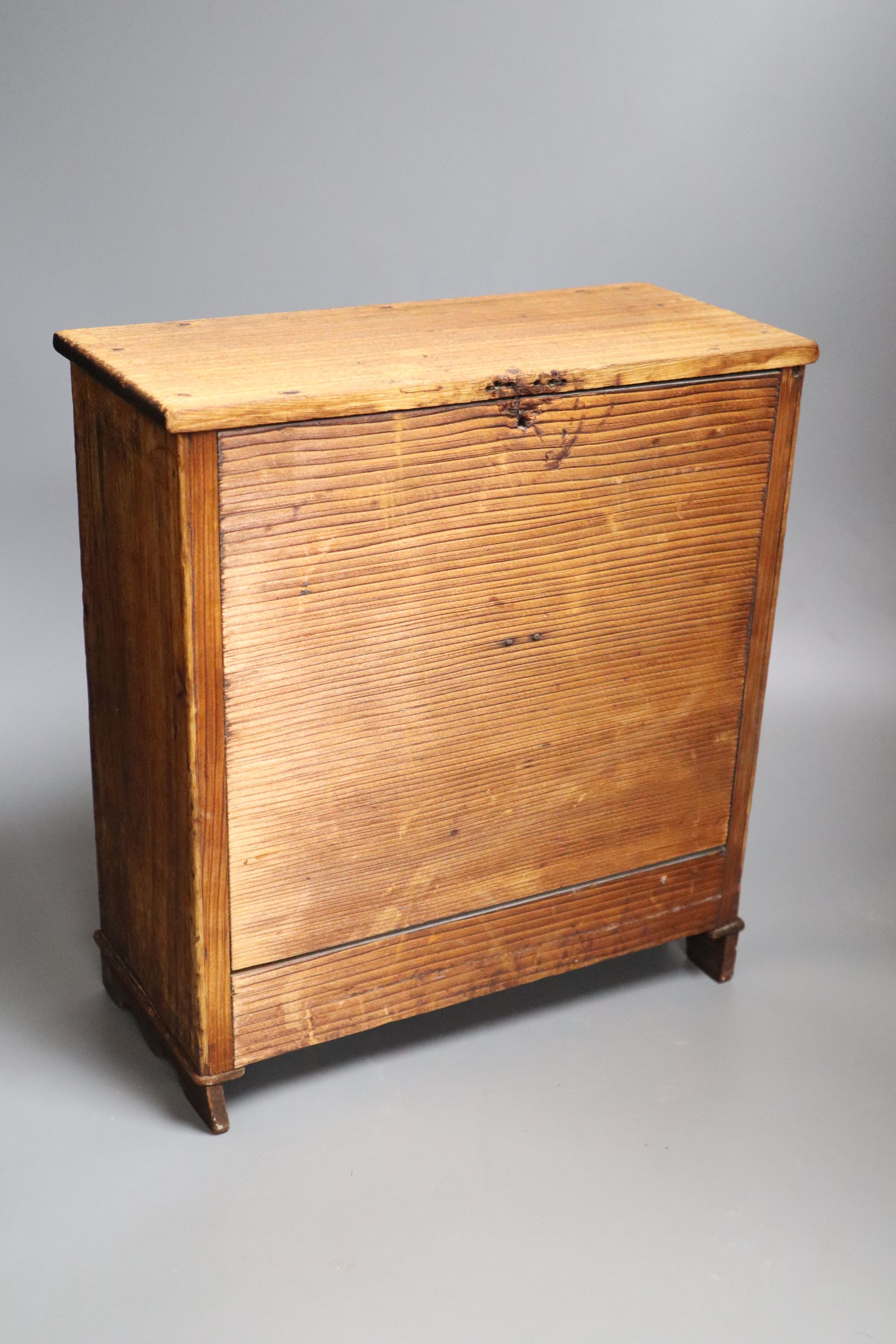 A miniature mahogany chest of drawers, height 33cm